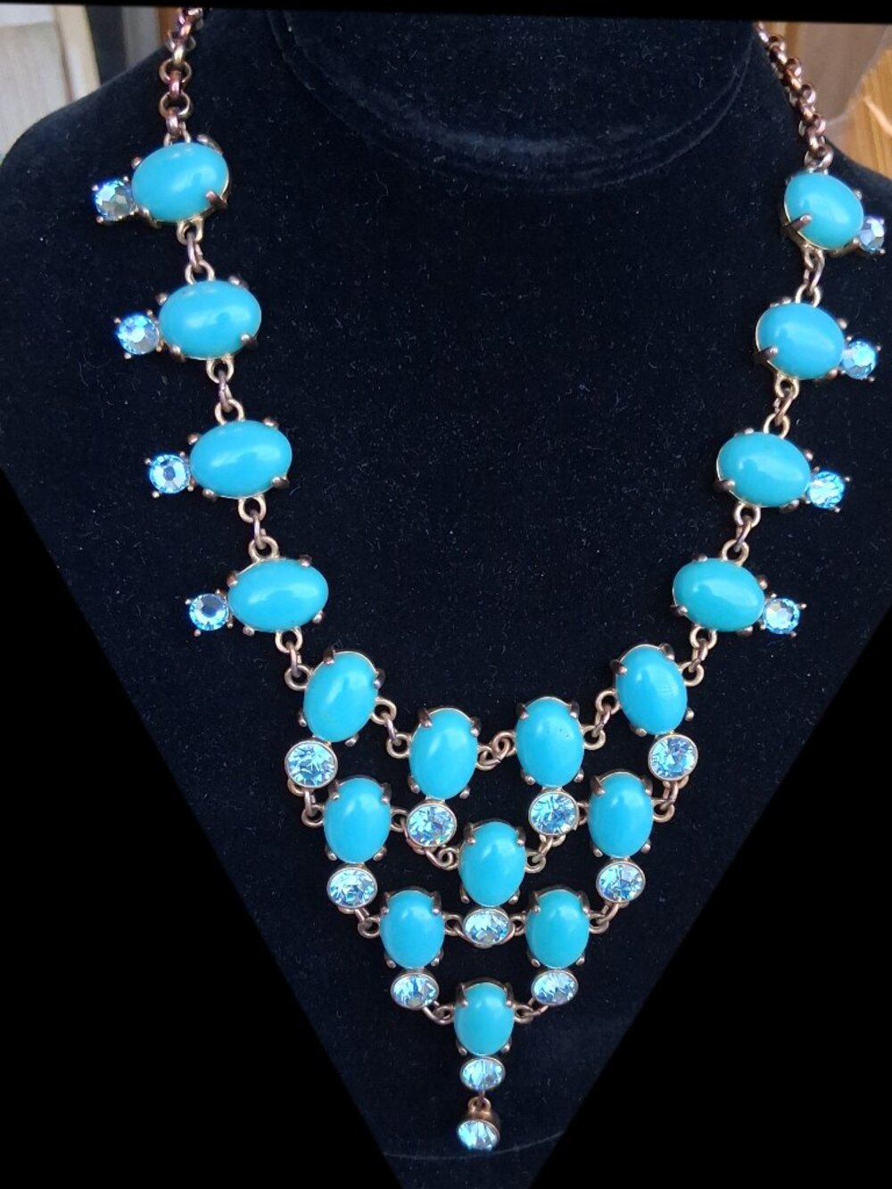 Faux turquoise statement bib necklace in gold tone